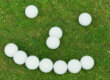 golfbälle bilden ein gesicht